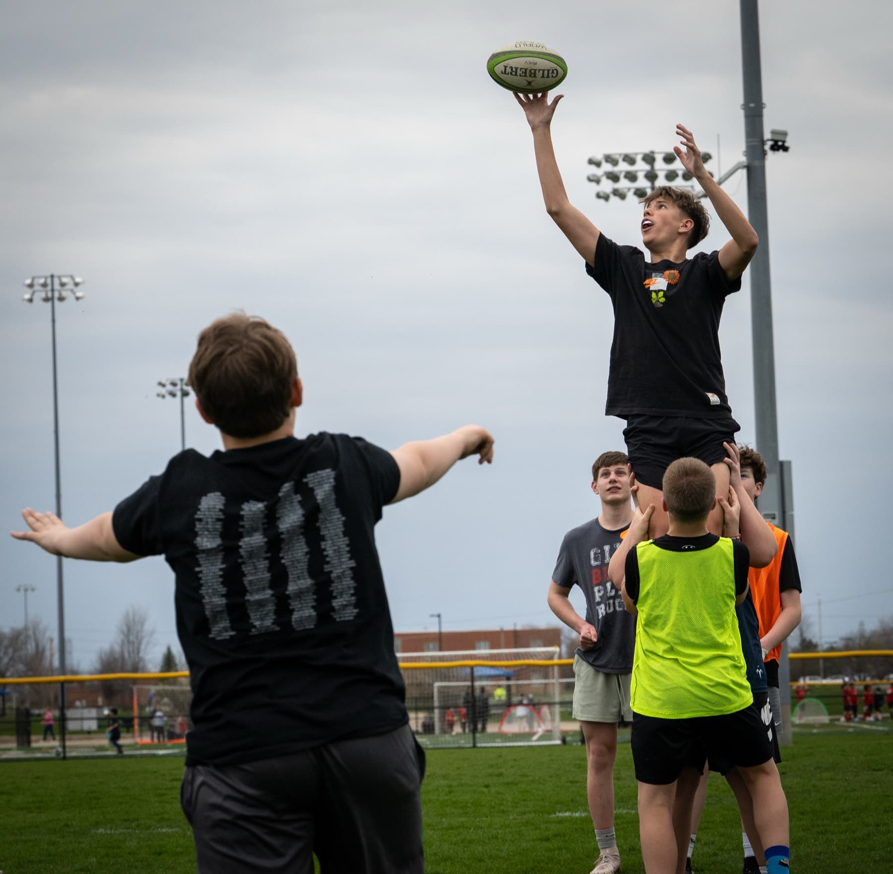 A Fortivus player rising to catch a rugby ball